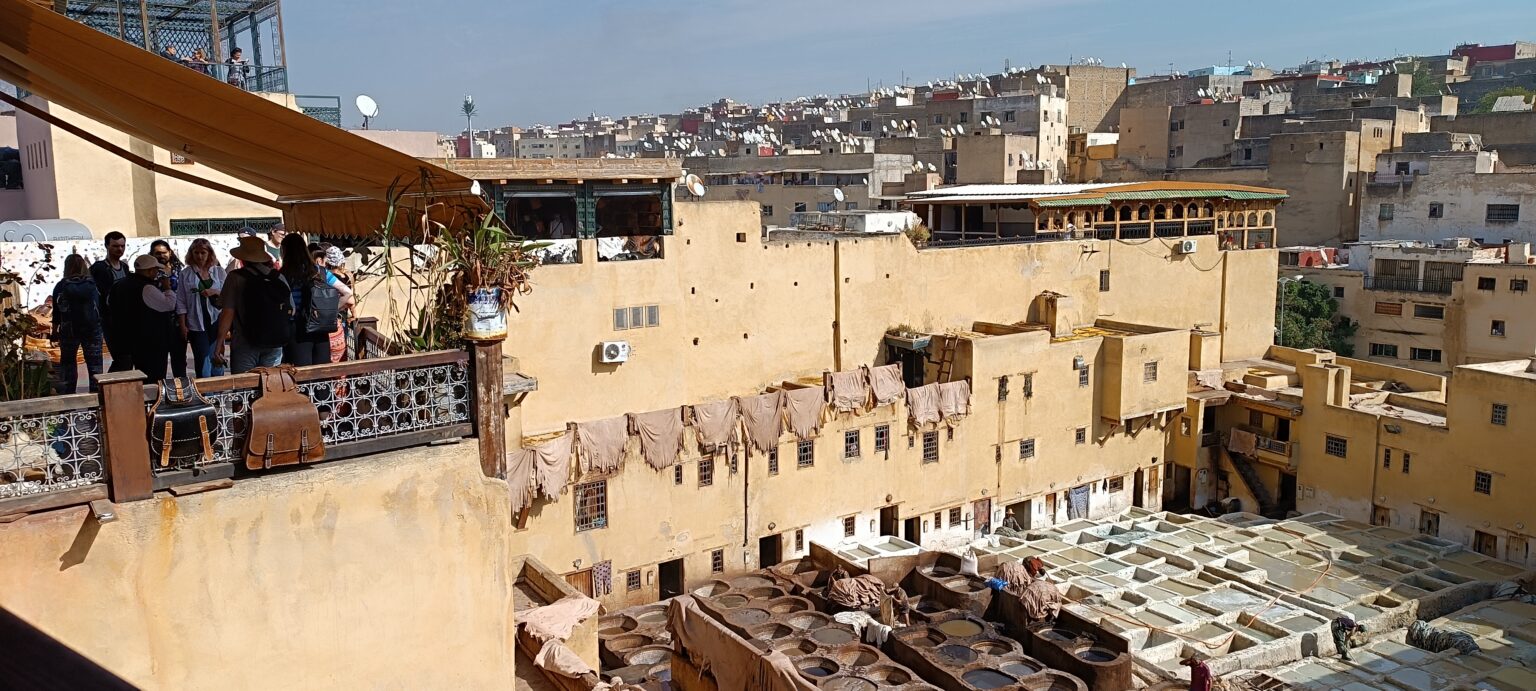 A group on a terrace above a tannery