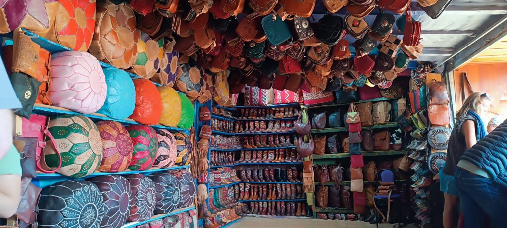 Shelves of leather poufs and slippers